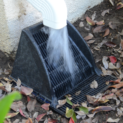 NDS downspout flowing into basin
